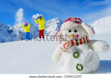 Ski, Skier, Sun And Winter Fun - Skiers With Snowman Enjoying Winter Holidays