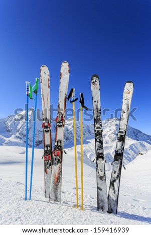 Skiing, winter season , mountains and ski equipments on ski run