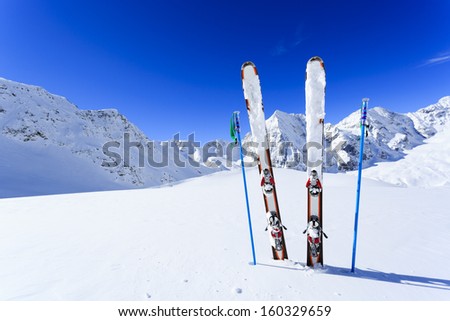 Ski, winter season , mountains and ski equipments on ski run