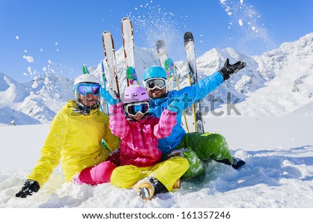 Ski, winter, snow,  skiers, sun and fun - family enjoying winter vacations