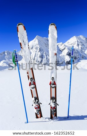 Ski, winter season , mountains and ski equipments on ski run