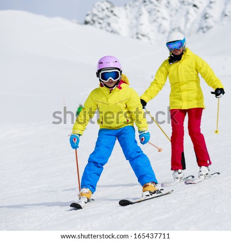 Skiing, winter, ski lesson - skiers on ski run