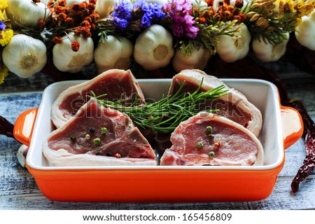 Lamb meat - fresh lamb chops with rosemary herbs