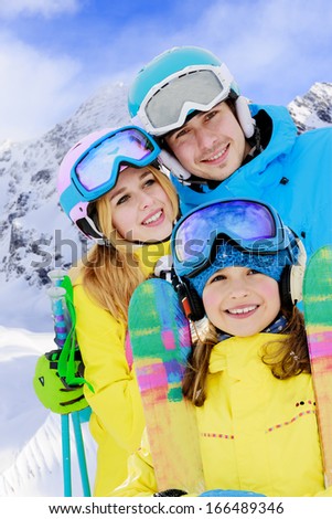 Ski, winter, snow, skiers, sun and fun - young skiers enjoying winter holidays