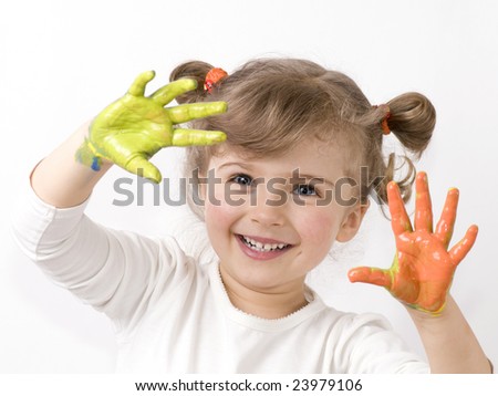 stock photo Cute girl playing with colors
