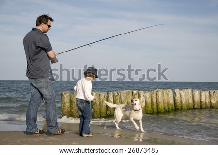 Family fishing with dog