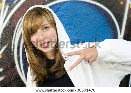 Happy young girl on graffiti background
