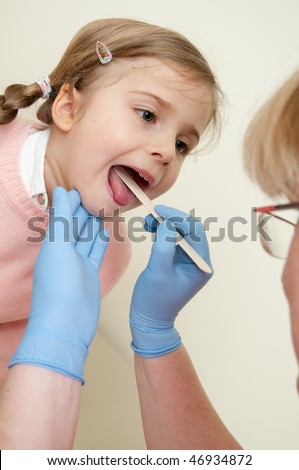 Doctor treat little girl for throat