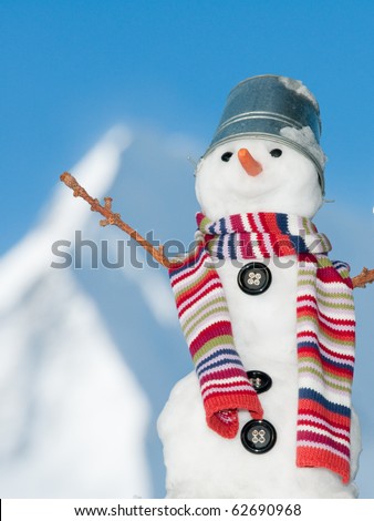 Happy snowman on mountain