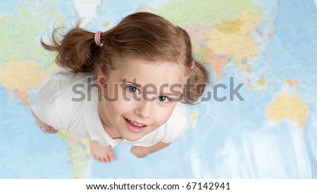All my world - happy little girl on map background