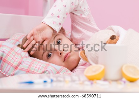 Medicines and hot tea in front, sick girl with teddy bear in bed ( No-name teddy bear )