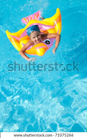 Little girl playing in blue water - no name inflatable toy