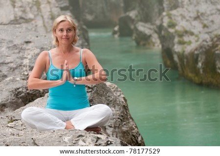 In harmony with nature - woman exercising in the rain