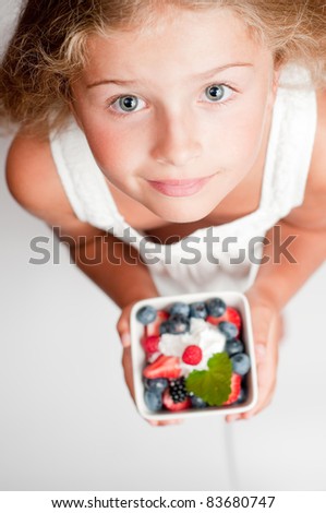 Healthy Food - Cute girl with fresh berries