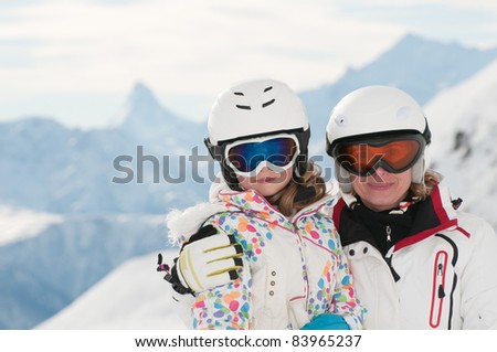 Winter, ski - family in winter resort portrait