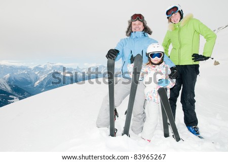 Winter, ski sun and fun - family in ski resort (copy space)