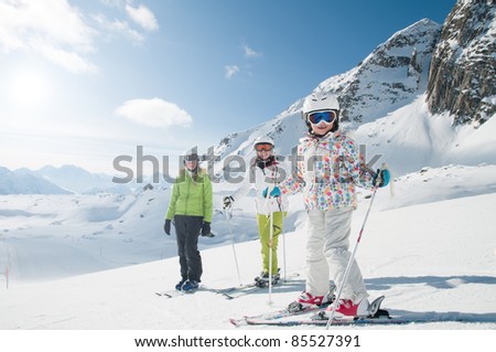 Skiing - skiers in winter resort