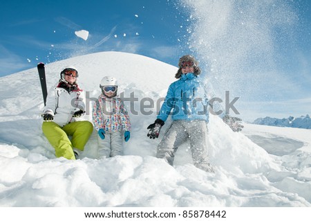 Winter, ski - family playing in snow