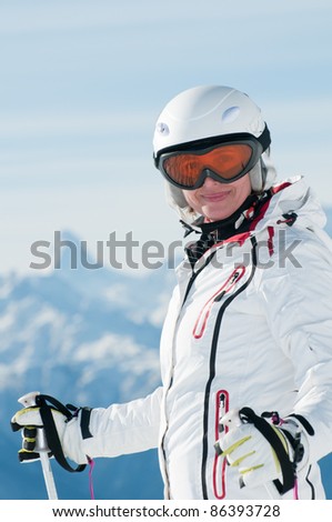 Skiing - portrait of female skier in Swiss Alps (space for text )