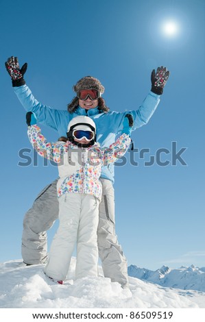 Skiing, skiers having fun on winter vacation (space for text, cover)