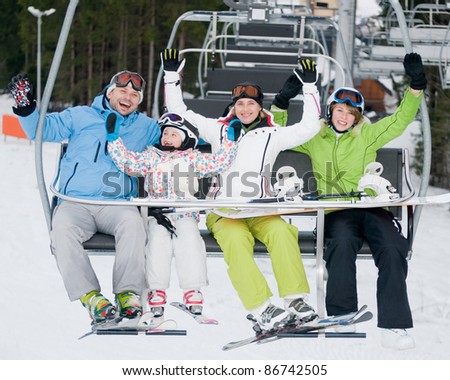 Skiing, ski lift - skiers on ski vacation