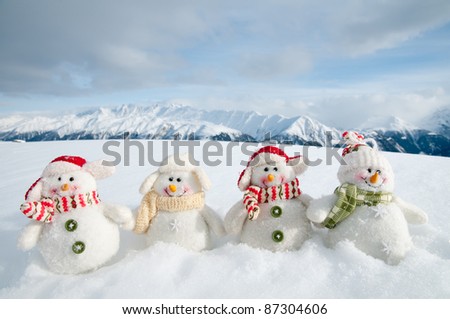 Merry Christmas - Snowman friends and snowy mountains in background