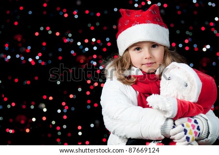 Magic Christmas lights - cute girl at Christmas night (no-name toy)