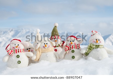 Winter, Christmas - happy snowman friends, snowy mountains in background