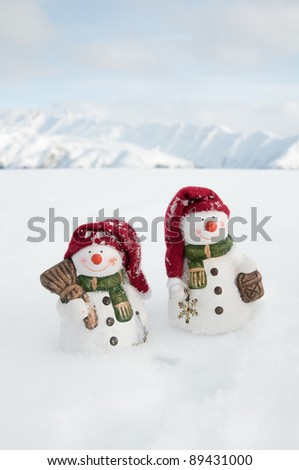 Winter, Christmas - happy snowman friends, snowy mountains in background