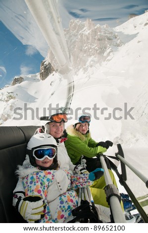 Skiing, ski lift - skiers on ski vacation