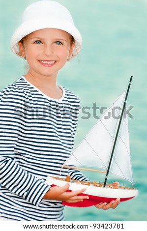 Summer holiday - little sailor dreaming about sailing