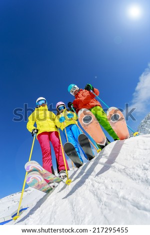 Skiing, winter, snow, skiers, sun and fun - family enjoying winter vacations