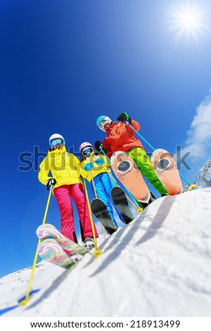 Skiing winter snow skiers sun and fun family enjoying winter vacations Skiing winter snow skiers sun and fun family enjoying winter vacations