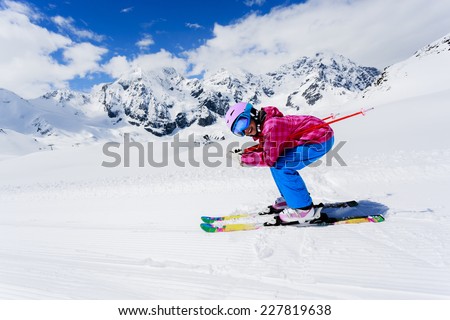 Skiing, winter sport - girl skiing downhill