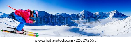 Skiing, winter sport  - skier on mountainside, panorama
