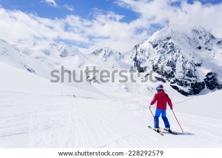 Skiing, winter sport, ski lesson - skier on mountainside