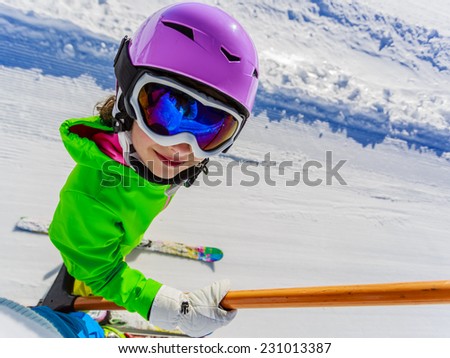 Skiing, ski lift - happy skier on ski lift