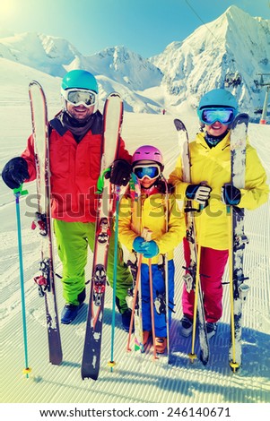 Skiing, winter sport - family enjoying winter vacations, filtered