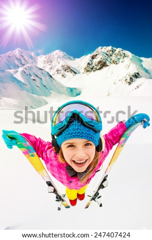 Ski, winter vacation, snow, skier, sun and fun - girl enjoying ski vacations, filtered