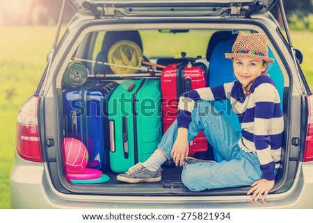 Summer vacation, young girl ready for travel for family vacation-filtered