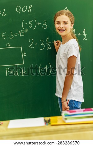 Back to school - beautiful girl on math lesson