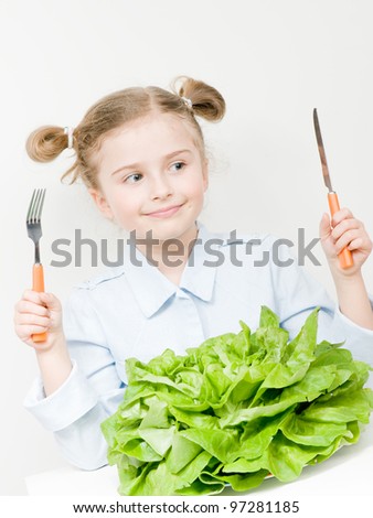 Vegetarian food - lovely girl with fresh lettuce