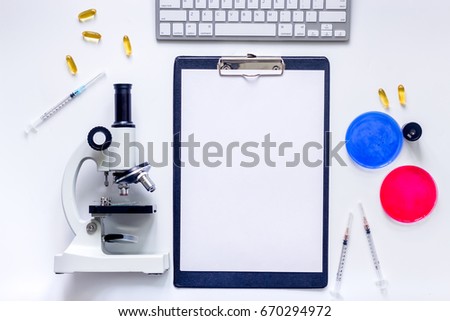 Medical tests. Work table of doctor witn microscope, Petri dish, syringe on white background top view mockup