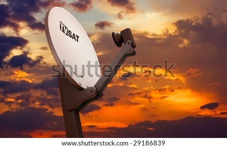 TV satellite dish over sunset sky