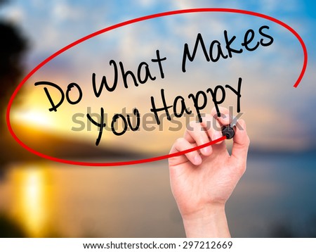 Man Hand writing Do What Makes You Happy  with black marker on visual screen. Isolated on nature. Business, technology, internet concept. Stock Photo
