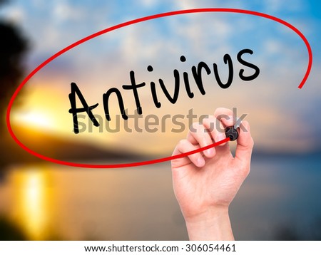 Man Hand writing Antivirus   with black marker on visual screen. Isolated on nature. Business, technology, internet concept. Stock Photo