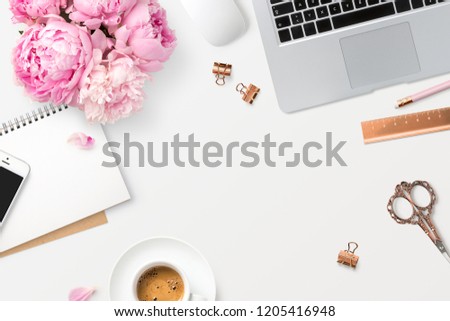 feminine workspace with laptop computer, smartphone, office supplies, a bunch of peonies and coffee on a white desk, top view / flat lay, copyspace for your text or headline