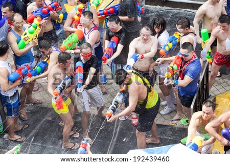 BANGKOK - APRIL 14,2014: BANGKOK - A water fight during Songkran Festival celebrations on Silom Road in Bangkok Thailand.
