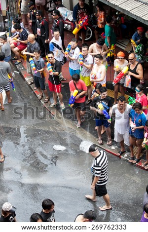 BANGKOK - APRIL 13,2015: BANGKOK - A water fight during Songkran Festival celebrations on Silom Road in Bangkok Thailand.