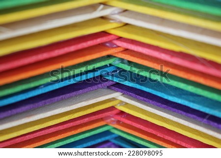 Colorful wooden pallets stacked.
